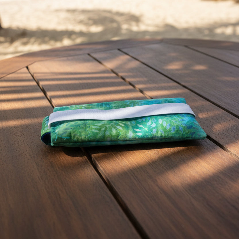 Glasses case on tropical beachside table