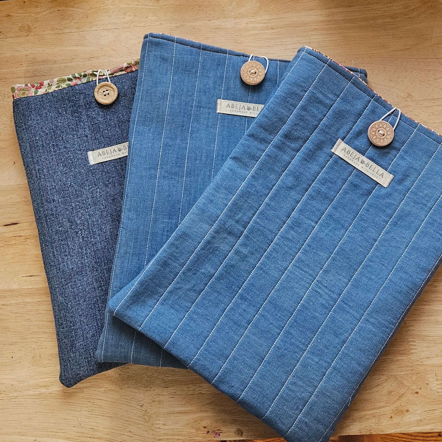 Denim iPad sleeves on wooden table