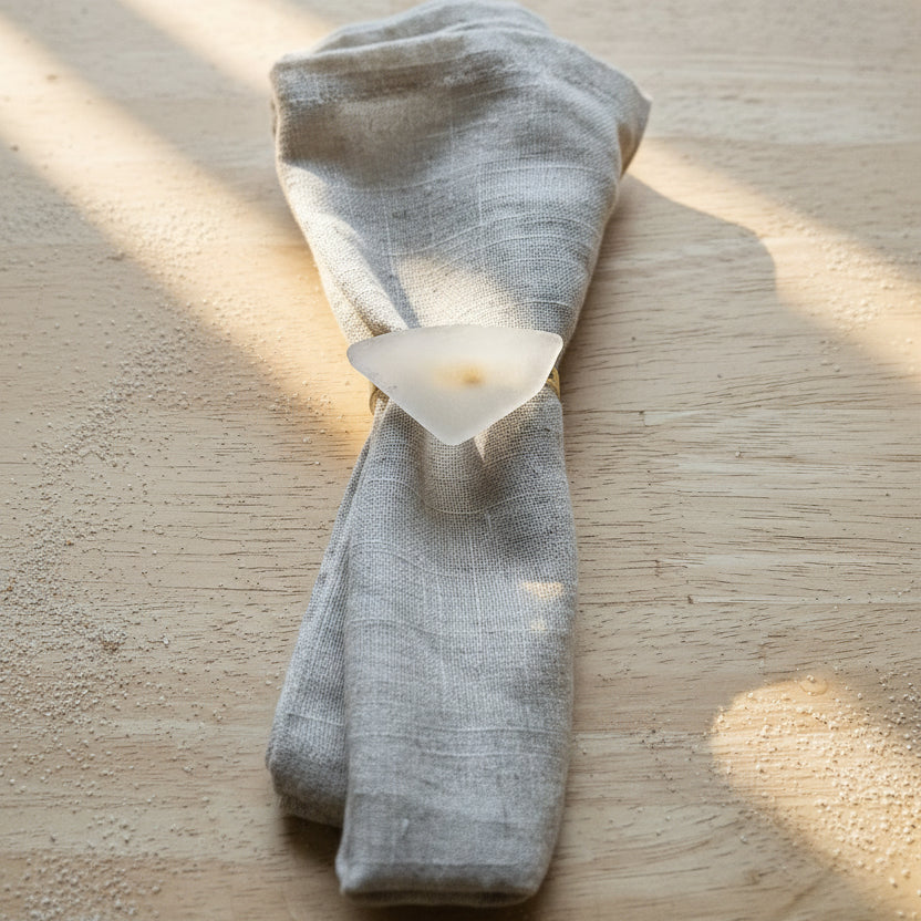 Sea glass napkin ring on linen napkin