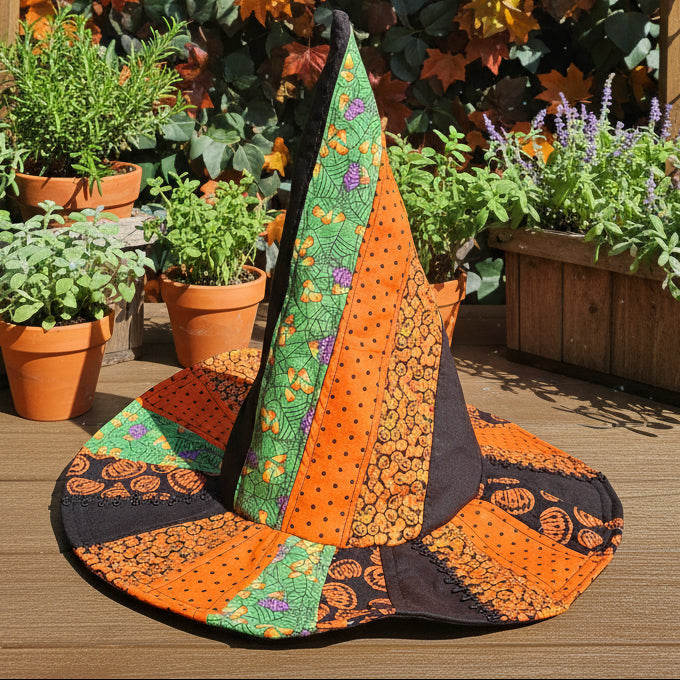 Hand quilted witch hat in an herb garden