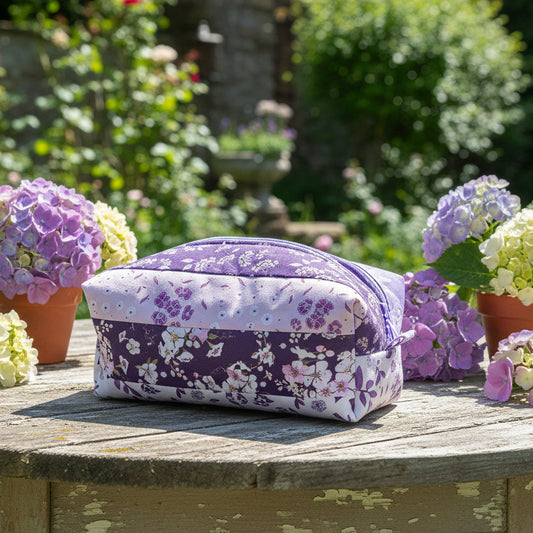 Floral-patterned cosmetic bag on a wooden surface