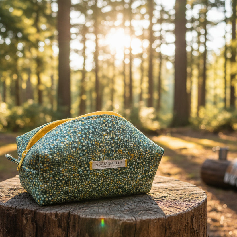 Green and gold cosmetic bag on a wooden surface