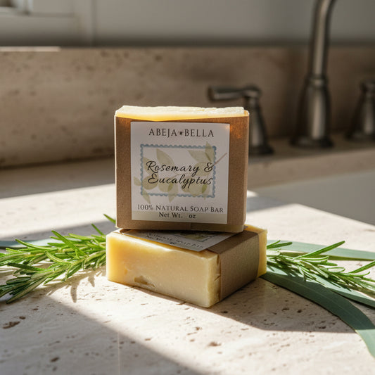 Two bars of soap with labels on a wooden surface